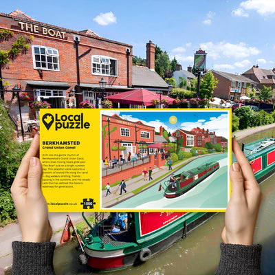 Hands holding "local Puzzle" box for Berkhamsted Grand Union Canal jigsaw puzzle in front of the actual location 