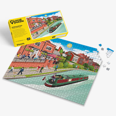 Berkhamsted Grand Union Canal Jigsaw puzzle with a colourful scene of a canal scene and yellow box packaging on a white background