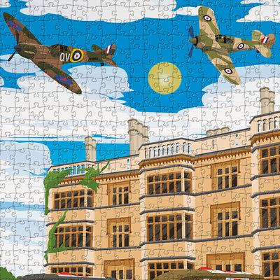 A closeup view of our Biggleswade Shuttleworth House jigsaw puzzle which depicts an Illustrated manor house with war-era planes flying overhead