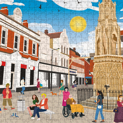 A closeup view of our Waltham Cross town centre jigsaw puzzle which depicts an Illustrated town with people, buildings, and part of the Eleanor Cross Monument
