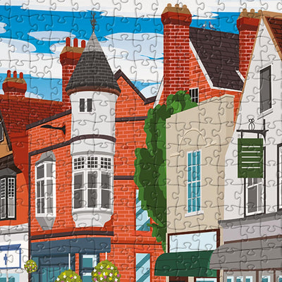 A closeup view of our Ware High Street jigsaw puzzle which depicts an Illustrated town with buildings