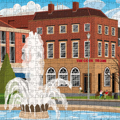 A closeup view of our Welwyn Garden City Town Centre jigsaw puzzle which depicts an Illustrated town with buildings and water fountain