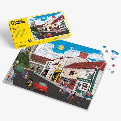 Welwyn High Street Jigsaw puzzle with a colourful scene of a village and yellow box packaging on a white background