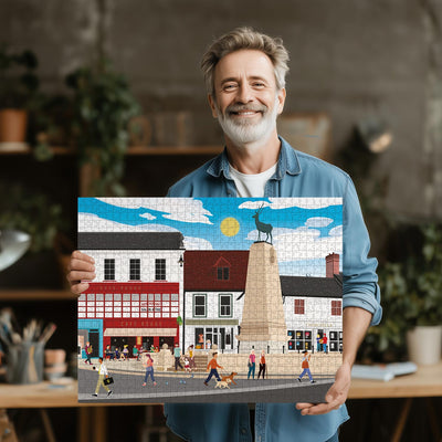 Man holding a completed Hertford Parliament Square jigsaw puzzle in his office or studio