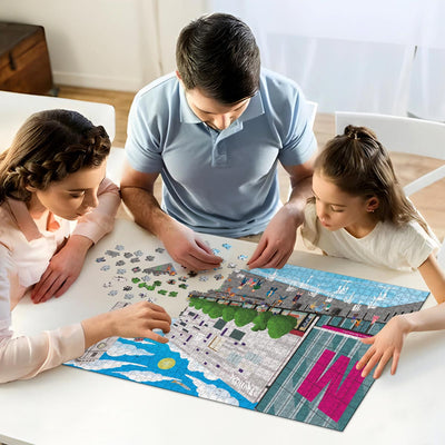 A mum, dad and daughter working on solving our Luton town centre jigsaw puzzle at home