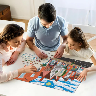 A mum, dad and daughter working on solving our Ware High Street jigsaw puzzle at home